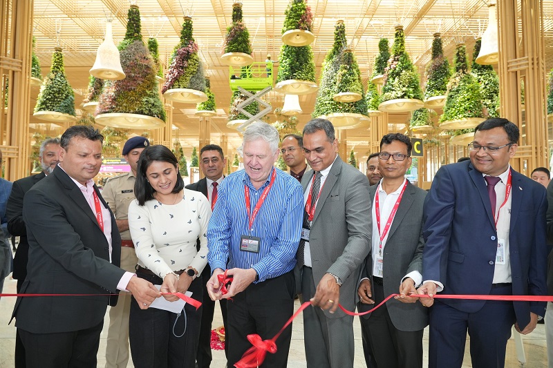 The launch of the self check-in and baggage drop on Air India's BLR-SFO sector. Donald Hunter and senior officials cutting the ribbon to open the servivce at the Bangalore International Airport.